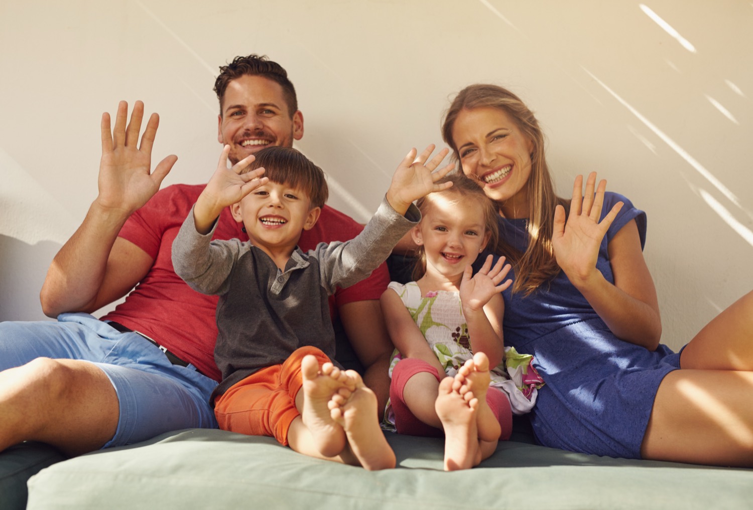 A happy family waving